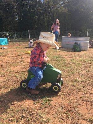 Working in his new boots and hat