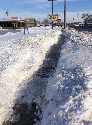 Emergency trails cut down S. Centerville road after sidewalks became buried in thick snow and ice from interstate plow trucks.