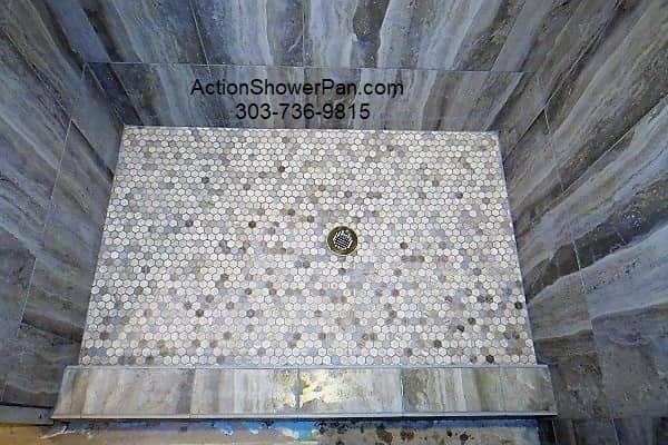 SHOWER PAN INSTALLER - This shower pan installation features 1x1 hex tiles and large format porcelain wall tiles