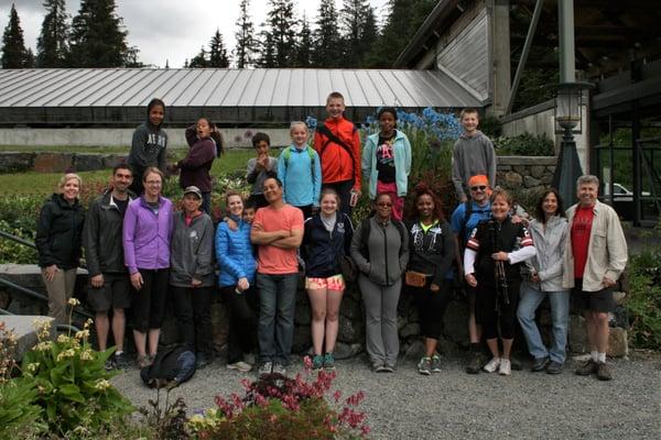 AKT Anchorage team members and their families head out on a hike.