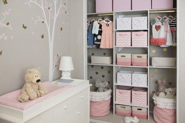 This feminine forest nursery was small, so we opted for an exposed closet. Shana created beautiful organization & added fun gold polka-dots!