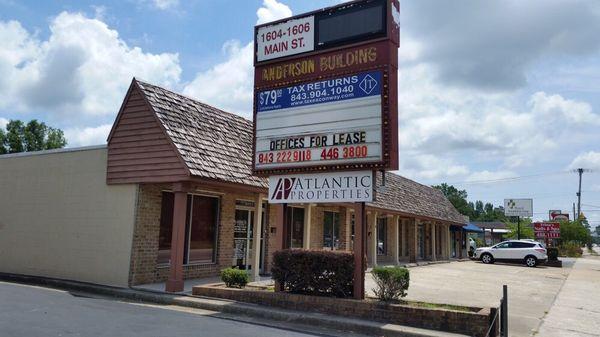 Store sign and parking.