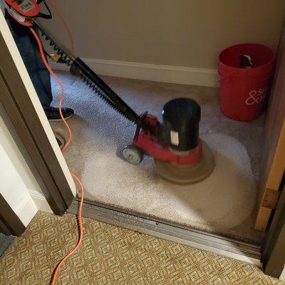 Brushing with buffer before steam cleaning helps agitate dirt and lift up piles of old carpet.