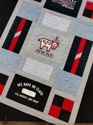 One side of a reversible t-shirt quilt designed by Rachel Ann Quilts in Little Chute, WI