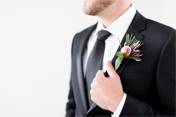 Groom in black tux