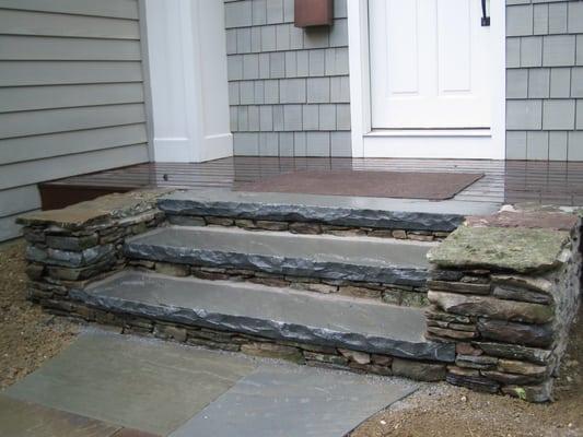 Stone steps Cornwall NY.  Flat fieldstone with moss and lichen.  Steps are 3" thick bluestone.