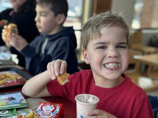 My buggy slammin his 4 PC. Crispy Chicken Nuggets in the Classic Chocolate Frosty #ThisIsTheWay