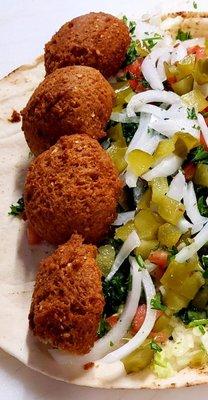 Our authentic Falafel Sandwich made with ground chick peas, fava beans, mixed veggies topped with tahini sauce!