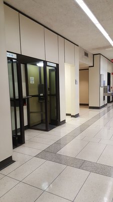 Courthouse hallway with empty phone booths of years gone by