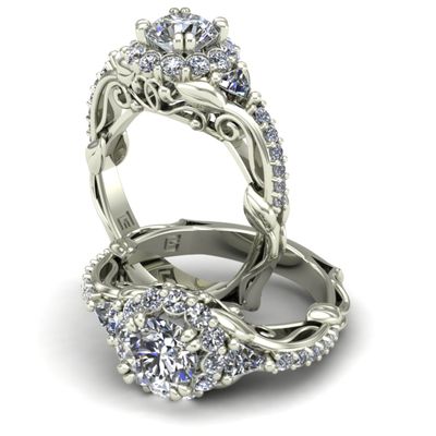 One carat round brilliant cut diamond with trillion diamonds in nature inspired solitaire