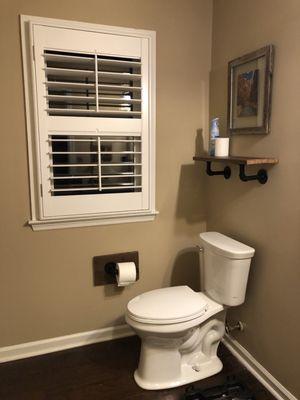 Reclaimed wood accents for bathroom renovation.