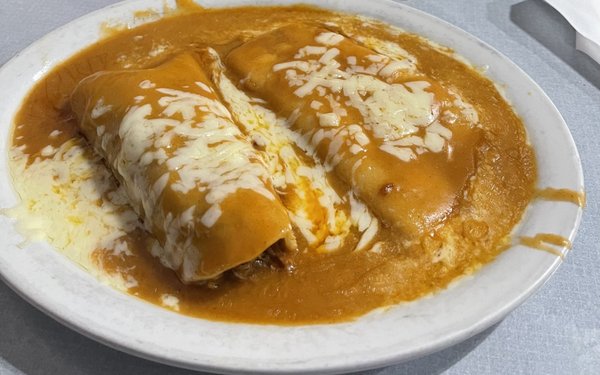 This is my go to, the shredded beef and cheese enchilada, covered in Molé sauce with cheese on top!