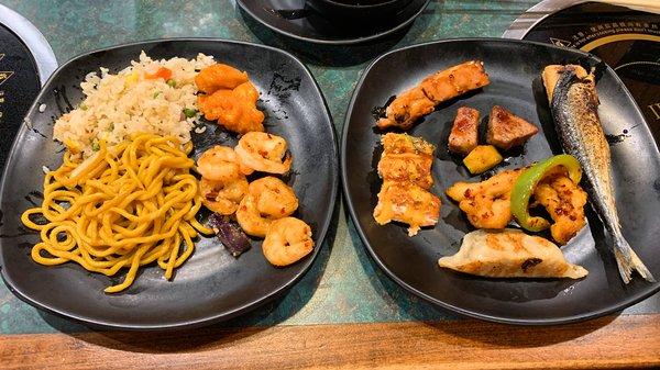 Fried rice, low mein, shrimp and chicken (left) and chicken, salmon, beef, calimari, dumpling, and grilled sardine (?) (right)