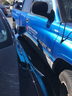 Apple Renovations truck parked inches from my car door.