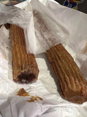 Freshly made Churros. Comes in a bag of 3-I ordered one of each-Chocolate, Strawberry and Cajeta syrup.