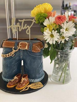 Birthday jeans cake  3D, serves 14 people. Flowers in vase for scale.