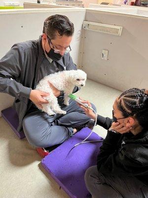 Juan doing his magic. Assistant applying cold laser.