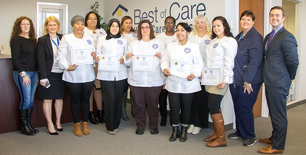 Home Health Aide Training Program graduates proudly display their HHA Certificates via partnership between Best of Care and Quincy College