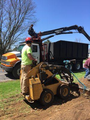 Loading brush from tree takedown also cleaning up yard by happy tree