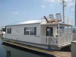 One of many houseboats available in Boston listed with Rock On Rentals