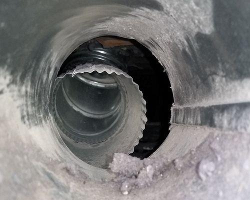 Cleaning vents with compressed air.