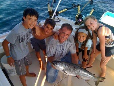 A father taking his kids out on Lake Michigan and bringing home a catch