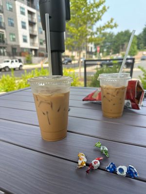 iced vanilla latte w oatmilk and free little candies