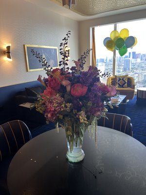 $150 arrangement full of orchids, hydrangea and peonies