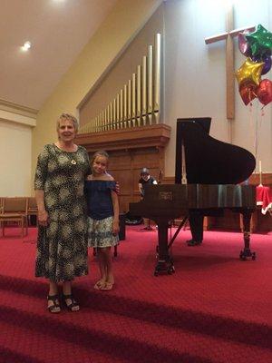 End of the year recital.  Kat with her piano teacher Jacqui.