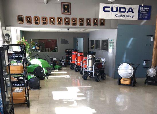 OUR SHOWROOM FLOOR WITH PRESSURE WASHERS, SCRUBBERS AND SWEEPERS, AND HEATERS.