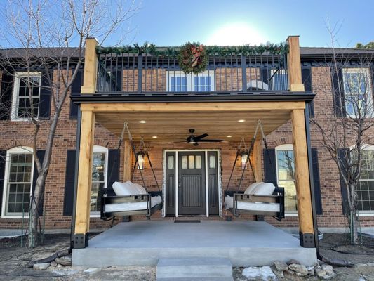 Custom deck in Broadmoor Springs: engineered for durability, waterproofed for longevity, and illuminated with elegant post lights