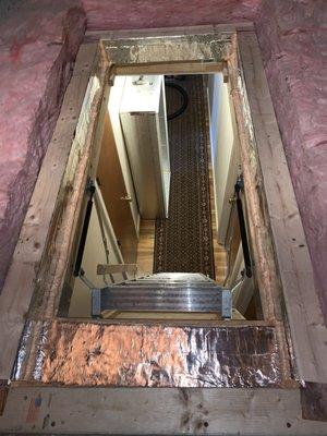 Attic pull down stairs with carpentry for cover and FG damming