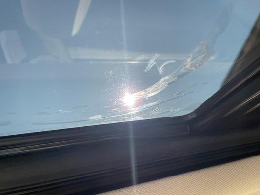 Vizion AutoSports - Bubbles in the roof tint, gaps in the edges, and loose tint hanging down.