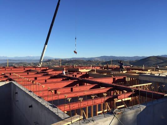 Part of the structural steel for a 25,000 square foot basement .