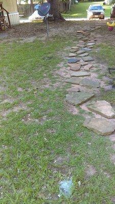 stone walkway job #2 not allowed to beak ground or add sand and boarders around the walkway so it is and remains in finished until notice