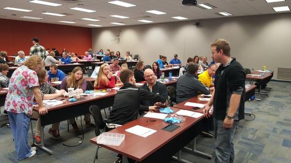 New Berlin teachers learning first aid and CPR, as well as how to use an AED.