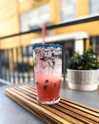 Botch-a-Me Blueberries muddled with lemon and rosemary. Sweetened with a homemade rosemary syrup and topped with bubbly water