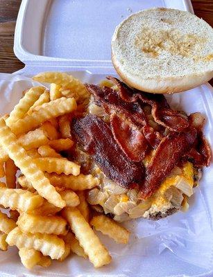 The Cess-nator- 12oz beef burger, bacon, sautéed onions, and cheddar cheese plus crinkle cut fries - about $15, huge burger!