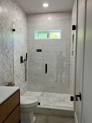 Glass shower doors with black hardware