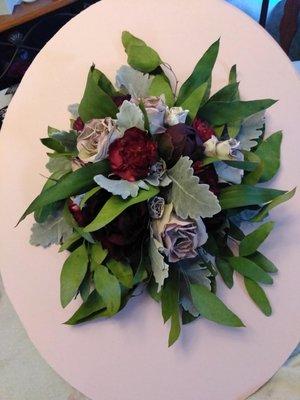 An Autumn bridal bouquet ready for the encasement frame.