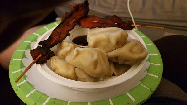 Pork Dumplings steamed/boiled - Tender and delicious. The dipping sauce has thinly sliced scallion that enhances its favor.