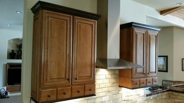 Crown molding, hardware, and tile backsplash installation.