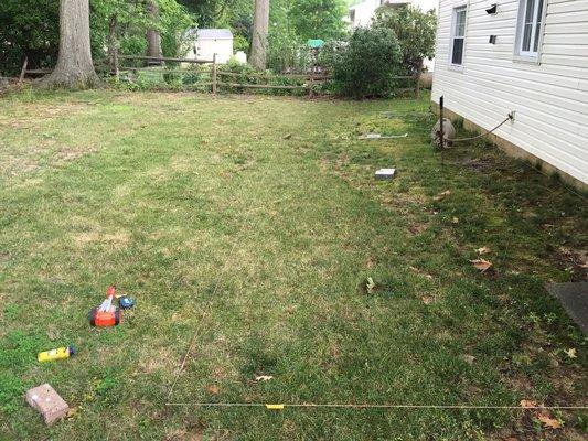 Before photo of a hardscape patio we created (part 1)