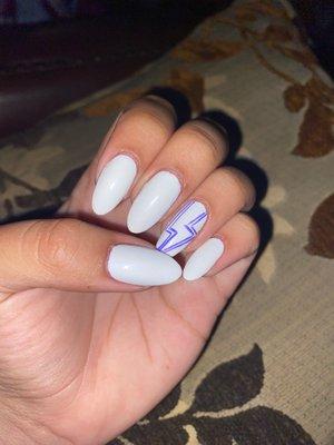 Manicure with lightning bolt design