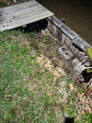 Bricks and rocks thrown in to holes.