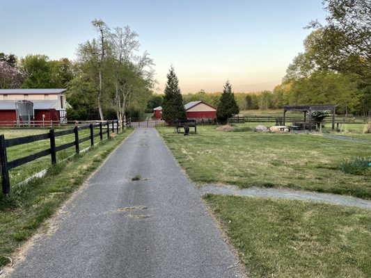 Smaller of two stables on left.