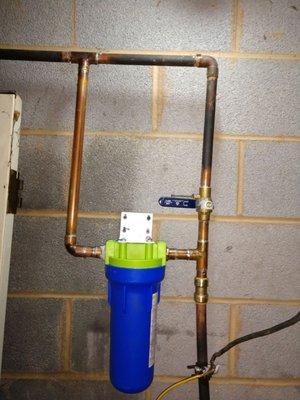 Soldered in new copper pipe for water filter system, also installed water filter system as well.