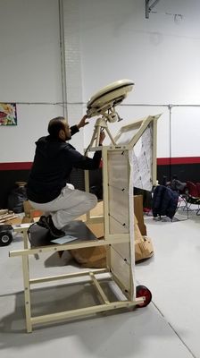 Cricket bowling machine being setup