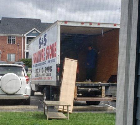 Balancing a heavy box on the edge of the truck and only moving it when asked to be careful.