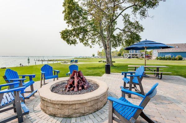 Guests enjoy the gas firepit overlooking Lake St. Clair in the lakefront park.